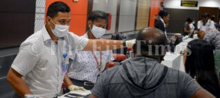 Cabin crew wear masks, gloves